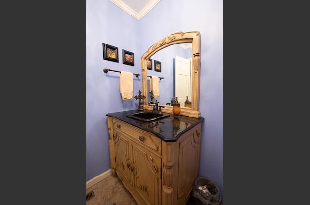 bathroom with vanity and ornamental molding