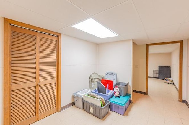 recreation room featuring a drop ceiling