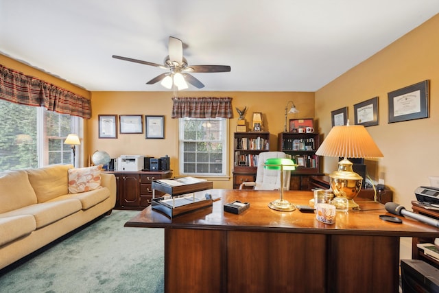 living room featuring carpet and ceiling fan