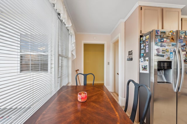 dining room featuring ornamental molding