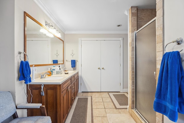 bathroom featuring vanity, ornamental molding, tile patterned floors, and walk in shower