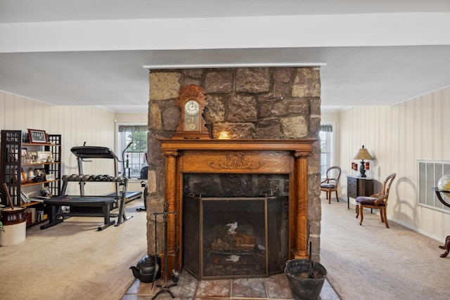 living room featuring carpet flooring and a fireplace