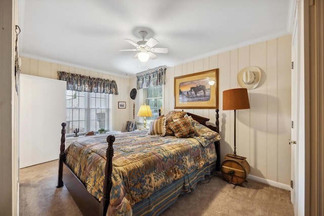 bedroom with ceiling fan, carpet, and crown molding