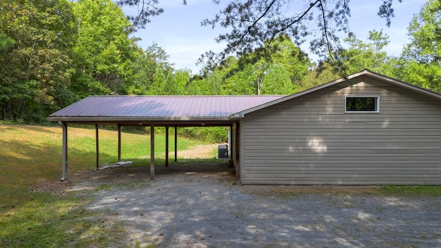 view of parking / parking lot featuring a carport