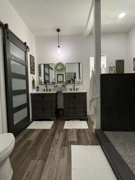 bathroom with vanity and wood-type flooring