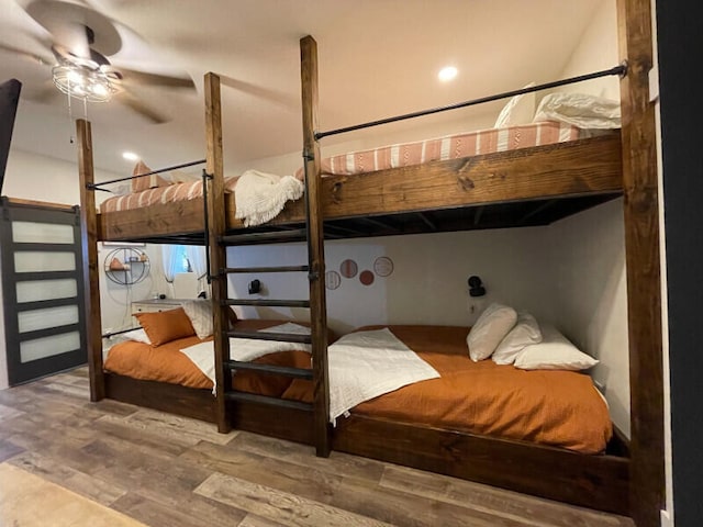 bedroom featuring ceiling fan and hardwood / wood-style flooring