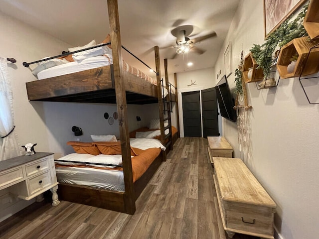 bedroom with ceiling fan and dark hardwood / wood-style floors