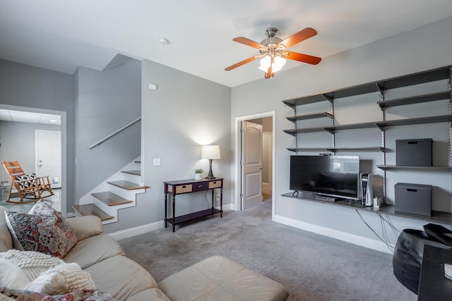 carpeted living room featuring ceiling fan