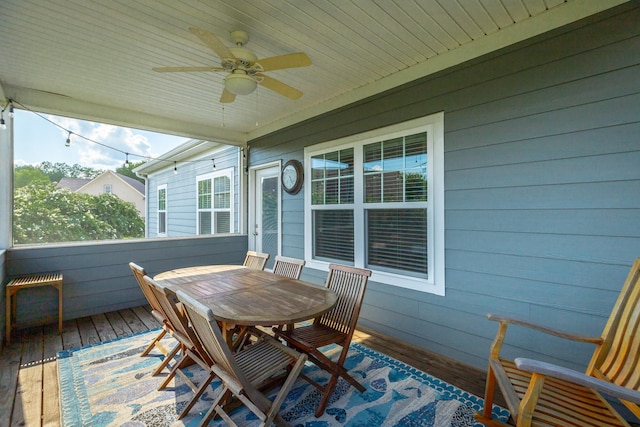 unfurnished sunroom with wooden ceiling and ceiling fan