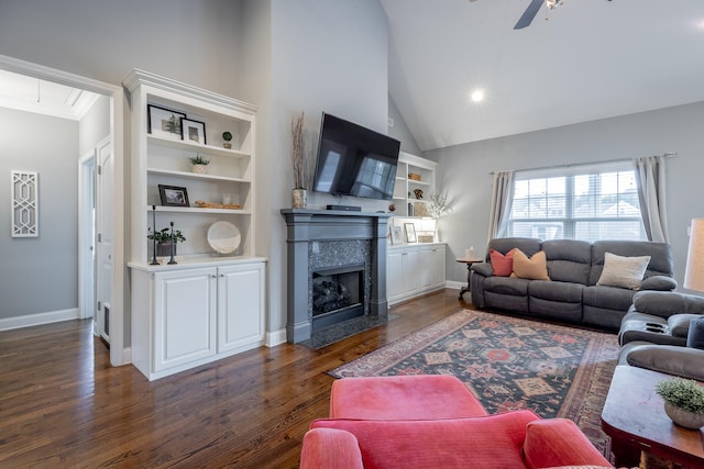 living room featuring a fireplace, dark wood-type flooring, lofted ceiling, and ceiling fan