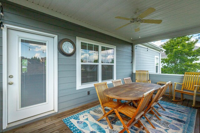 wooden terrace featuring ceiling fan