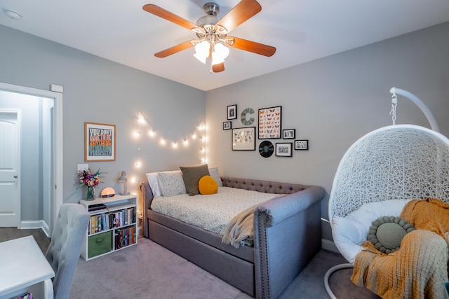 carpeted bedroom featuring ceiling fan