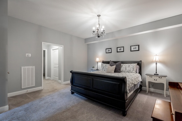 bedroom featuring a chandelier and carpet