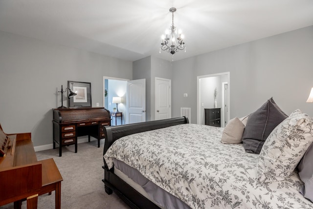 bedroom featuring light colored carpet, connected bathroom, and a notable chandelier