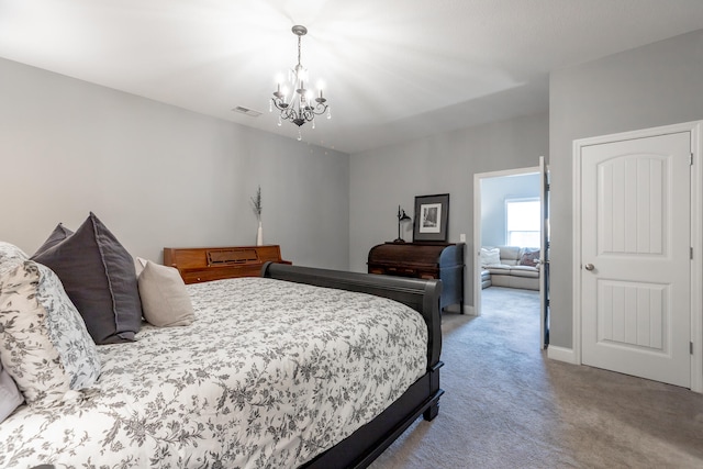 bedroom featuring light carpet and a chandelier