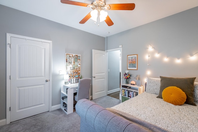 carpeted bedroom featuring a closet and ceiling fan