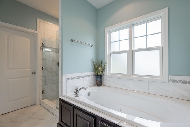 bathroom with separate shower and tub and tile patterned floors