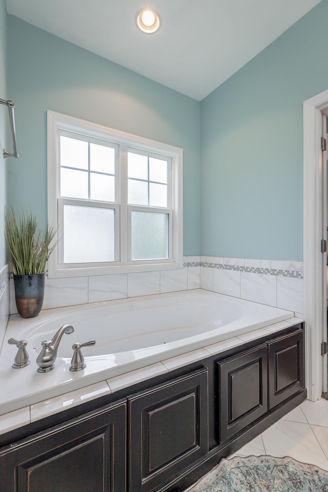 bathroom featuring a bathing tub and tile patterned flooring