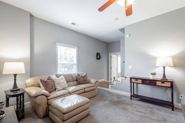 carpeted living room featuring ceiling fan