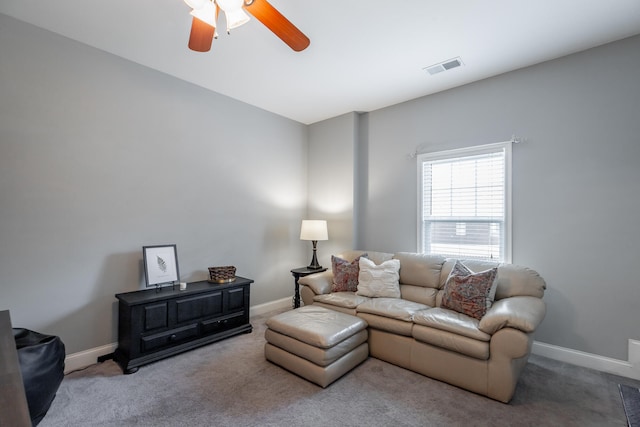 living room featuring carpet and ceiling fan