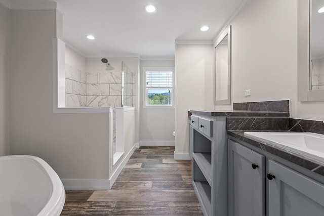 bathroom with independent shower and bath, vanity, ornamental molding, and hardwood / wood-style flooring