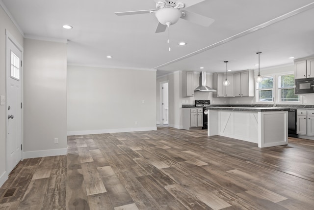 kitchen featuring wall chimney exhaust hood, black appliances, dark hardwood / wood-style flooring, and a center island