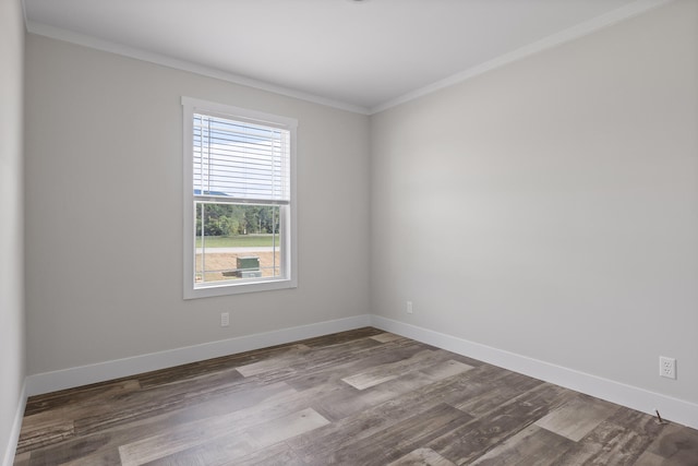 empty room featuring crown molding and hardwood / wood-style floors