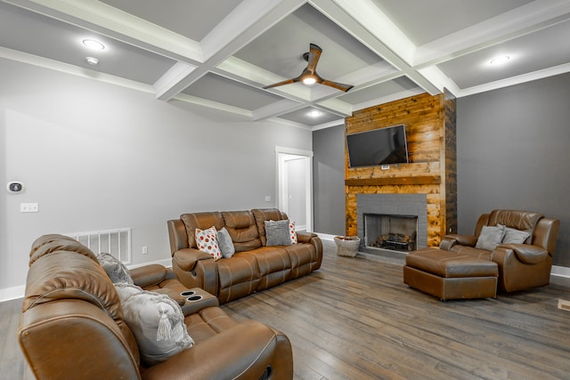 living room featuring hardwood / wood-style flooring, a fireplace, beamed ceiling, coffered ceiling, and ceiling fan