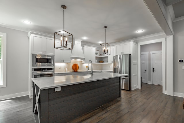 kitchen featuring pendant lighting, appliances with stainless steel finishes, and dark wood-type flooring