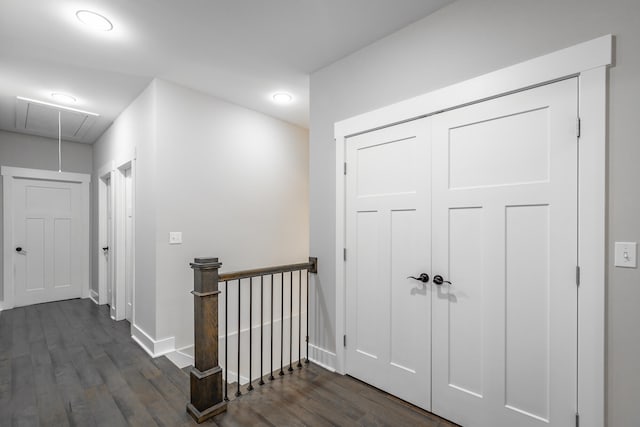 corridor featuring dark hardwood / wood-style flooring