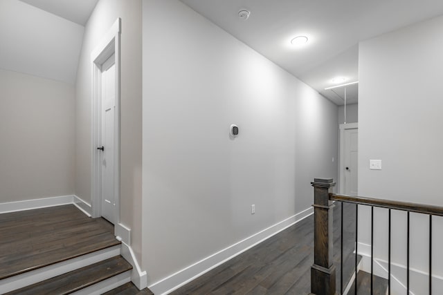 corridor with dark hardwood / wood-style floors