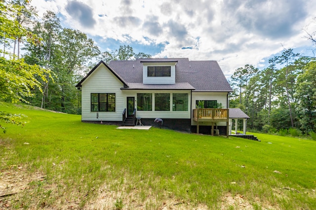 back of house with a lawn