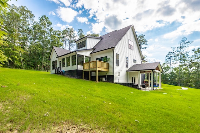 back of house featuring a yard, a patio, and central air condition unit