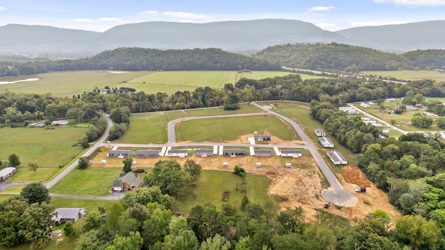 aerial view with a mountain view and a rural view