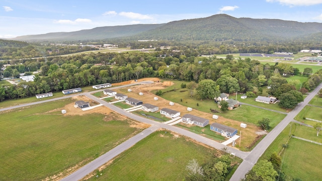 birds eye view of property with a mountain view