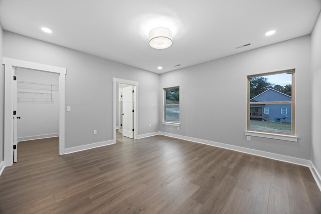 unfurnished room featuring dark wood-type flooring