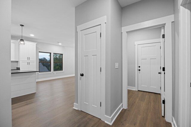 hallway featuring dark hardwood / wood-style floors