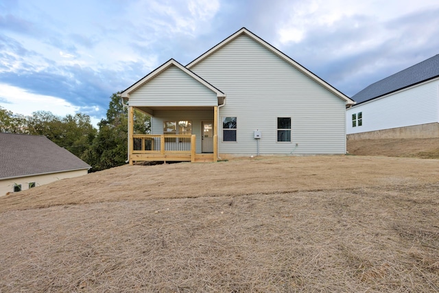 back of house with covered porch