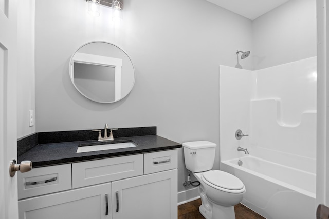 full bathroom with  shower combination, vanity, and toilet