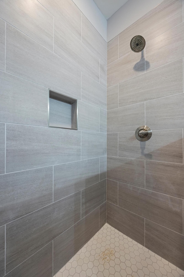 bathroom with a tile shower