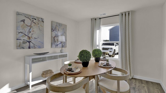 dining space featuring light hardwood / wood-style floors