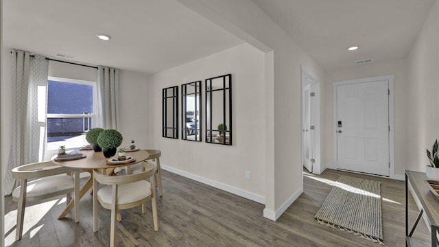 dining area with dark hardwood / wood-style floors