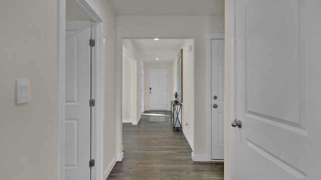 corridor with hardwood / wood-style floors