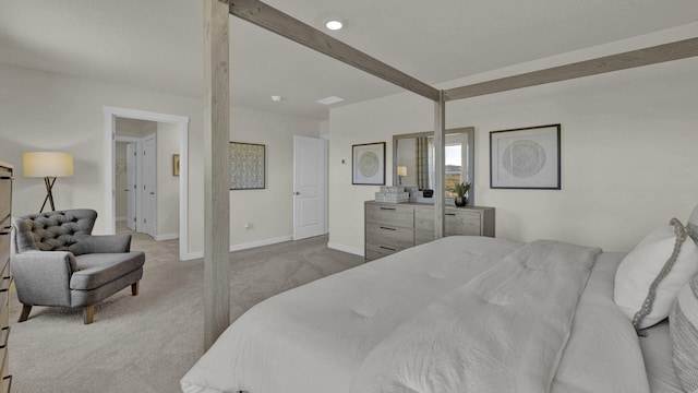 carpeted bedroom featuring beamed ceiling