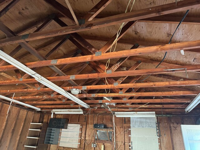 details featuring wood walls, beam ceiling, and wooden ceiling