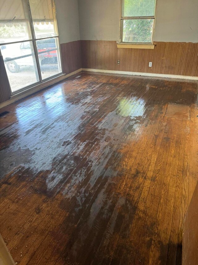 empty room with dark hardwood / wood-style floors