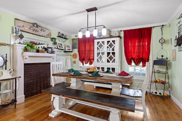 dining area featuring a textured ceiling, ornamental molding, and dark hardwood / wood-style flooring