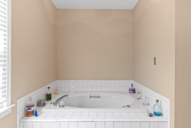 bathroom with tiled bath