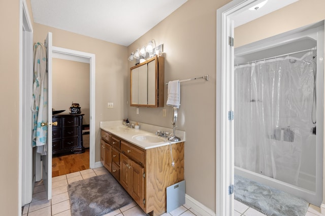 bathroom with vanity, a shower with shower curtain, and tile patterned floors