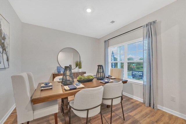 dining room with hardwood / wood-style flooring